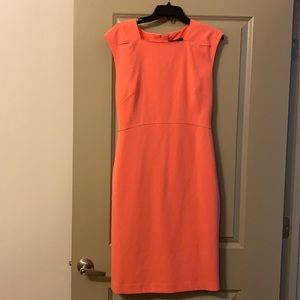 Coral dress with slight sleeve.